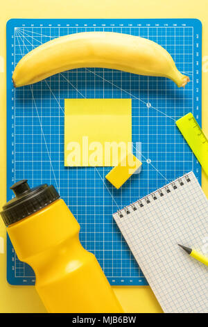 Set of school and preschool childrens accessories for learning letter education on background of yellow paper and drawing board Concept Back to School Stock Photo