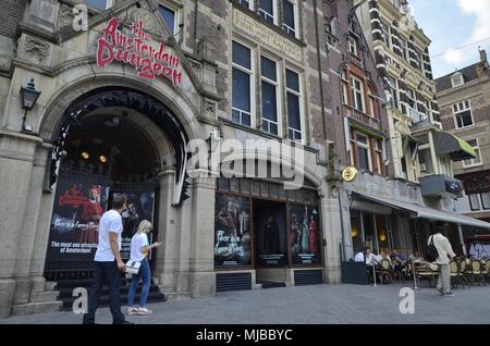 Amsterdam, Netherlands: The entrance of the Amsterdam Dungeon horror theater on the Rokin, among pedestrians in the foreground. Stock Photo
