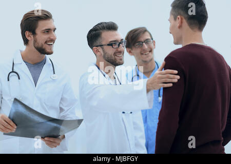 smiling doctors congratulating the patient's recovery Stock Photo