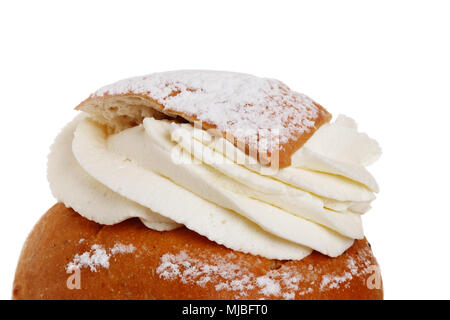 Detail of a shrove bun, consists of light wheat bread with almond paste and whipped cream filling, isolated on wgite background. Stock Photo