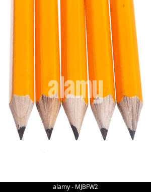 Detail of five yellow sharpened pencils isolated on white background. Stock Photo