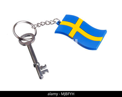 A key attached to a key ring with the Swedish flag isolated on white background. Stock Photo