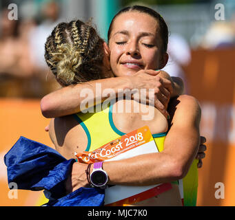 GOLD COAST, AUSTRALIA - APRIL 8: Jemima Montag of Australia being congratulated aftercrossing the finishing line to win the Women's 20k Walk at the Go Stock Photo