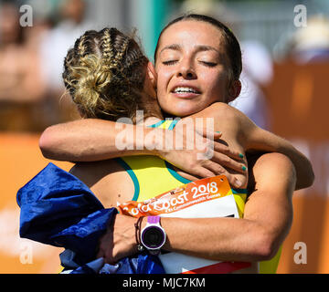 GOLD COAST, AUSTRALIA - APRIL 8: Jemima Montag of Australia being congratulated aftercrossing the finishing line to win the Women's 20k Walk at the Go Stock Photo