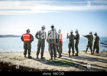 180430-N-PE825-0069 NAVAL STATION ROTA, Spain (April 30, 2018) –Capt. Cameron Geertsema, commander, 22nd Naval Construction Regiment, Seabees assigned to Naval Mobile Construction Battalion (NMCB) 11, and NMCB-1 take a tour of a shoreline erosion project during a visit to Naval Station Rota, Spain, April 30, 2018. NMCB-11 is forward-deployed to execute construction, humanitarian and foreign assistance, special operations combat service support, and theater security cooperation in the U.S. 6th Fleet area of operations. (U.S. Navy photo by Mass Communication Specialist 1st Class Collin Turner/Re Stock Photo