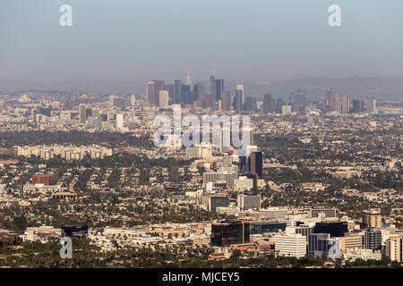 Los Angeles, California, USA - April 18, 2018:  Aerial view of smoggy downtown towers and mid Wilshire buildings. Stock Photo