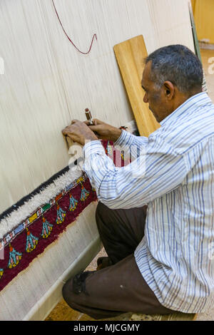 A carpet weaver at the El Tohamy Carpet School in Cairo, Egypt, Africa Stock Photo