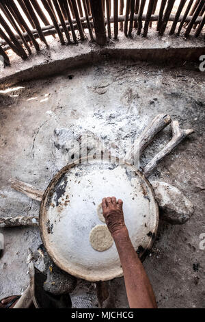 Manufacture of Mexican corn tortillas inside a traditional Mayan house in the state of Yucatan in Mexico Stock Photo