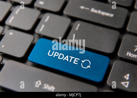 Online update computer keyboard button for internet software concept. Updating process keypad key in blue color. Stock Photo