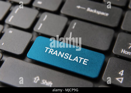 Multi language translation concept: blue computer button closeup with translate text on keyboard. Stock Photo