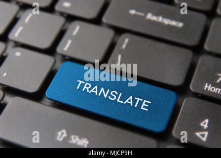 Language translation service concept, red computer button with translate text for multilingual support. Stock Photo