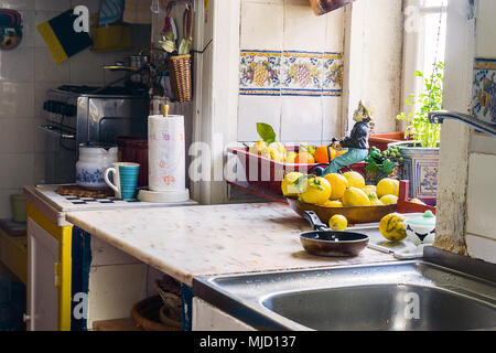 Traditional, simple kitchen interior with fruits by the window Stock Photo