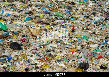 garbage bags and plastic bottles and other polyethylene labels and packages at the city dump