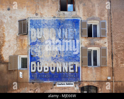 Old writing and advertisement on an exterior wall, France, Provence Stock Photo