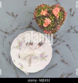 Heart with roses and lavender, plate, cutlery Stock Photo