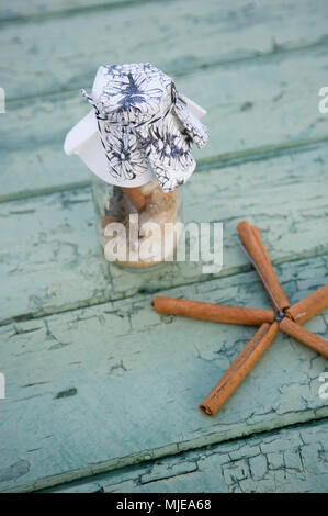 DIY, glass with herb for mulled wine and star made of cinnamon sticks Stock Photo