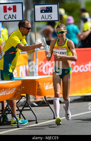 GOLD COAST, AUSTRALIA - APRIL 8: Claire Tallent of Australia grabbing some water in the Women's 20k Walk at the Gold Coast 2018 Commonwealth Games at  Stock Photo