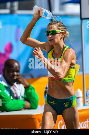 GOLD COAST, AUSTRALIA - APRIL 8: Claire Tallent of Australia grabbing some water in the Women's 20k Walk at the Gold Coast 2018 Commonwealth Games at  Stock Photo