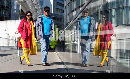 London, UK.  5 May 2018.  UK Weather - Tourists create a vivid reflection as they cross a bridge in Paddington Basin in the warmth of the late afternoon sun.  Even warmer temperatures are expected on Bank Holiday Monday.  Credit: Stephen Chung / Alamy Live News Stock Photo