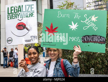 New York, USA, 5 May  2018. Protesters carry signs as they participate in the 2018 NYC Cannabis parade, a four-decade old tradition in New York city to demand an end to cannabis prohibition. Photo by Enrique Shore / Alamy Live News Stock Photo