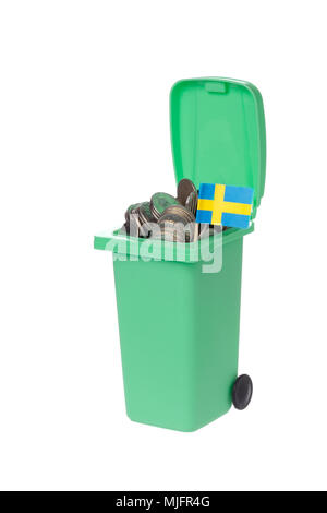 Green recycling bin with coins and Swedish flag isolated on white background. Stock Photo