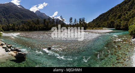 Panoramic view of a beautiful turquoise river at the end of the Hollyford Road, near Milford Sound, Fiordland National Park, New Zealand Stock Photo