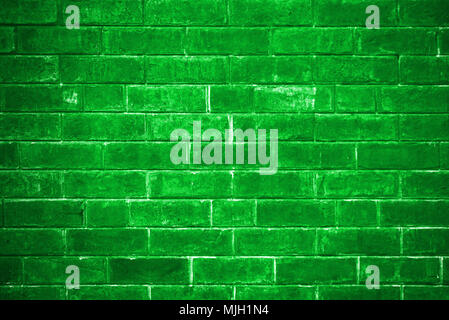 green brick wall getting older from the bottom Stock Photo