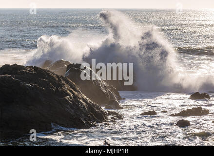 Waves crashing on rocks of Atlantic Ocean shore, view from Molhe beach in Nevogilde civil parish of Porto, second largest city in Portugal Stock Photo