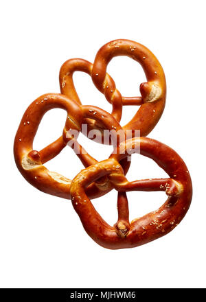 German Soft Pretzel. Three German bread pretzels on a white background. Stock Photo
