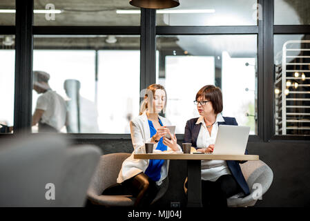Business women working in the cafe Stock Photo