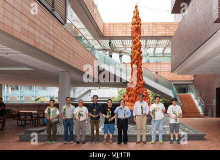 Annual cleaning of Danish artist Jens Galschiot's 'Pillar of Shame' at Hong Kong University Pok Fu Lam Hong Kong. The sculpture is a memorial to the 1 Stock Photo