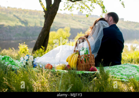 Guests Throwing Confetti Over Bride And Groom At Wedding Stock Photo