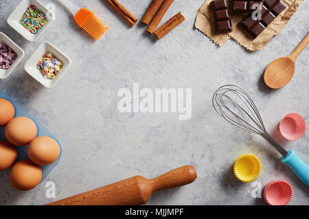 Various baking ingredients and utensils  on the kitchen table. Stock Photo