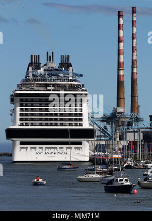 The MSC Meraviglia as it's docked in Dublin during it's maiden call to the city. At 315 metres long and 65 metres tall the ship can hold 5,700 guests making it the largest ever cruise ship (by passenger capacity) to dock in Ireland. Stock Photo