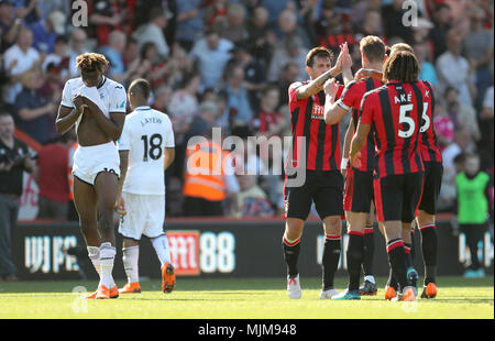 Swansea City's Tammy Abraham (left) appears dejected as AFC Bournemouth players celebrate winning 1-0 at the end of the Premier League match at the Vitality Stadium, Bournemouth. Stock Photo