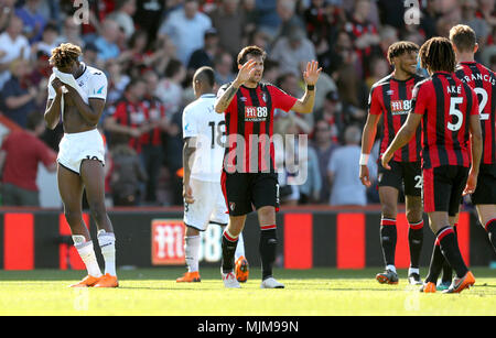 Swansea City's Tammy Abraham (left) appears dejected as AFC Bournemouth players celebrate winning 1-0 at the end of the Premier League match at the Vitality Stadium, Bournemouth. Stock Photo