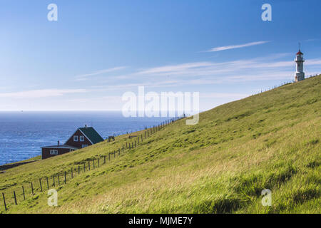 Lighthouse on islet known as Mykines Holmur, Mykines island, Faroe Islands, Denmark Stock Photo