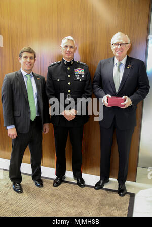 Christopher Perkins (left), the managing director of Citigroup, Lt. Gen. Rex McMillian (center), commander of Marine Forces Reserve and Marine Forces North, and Michael O’Neill (right), the chairman of Citigroup pose for a group photo on Dec. 8, 2017 at Citigroup Center, New York. McMillian spoke with Citigroup employed veterans and executives about the Marine Forces Reserve Toys for Tots program. This is the 70th anniversary season of Toys for Tots. Since its inception in 1947, the nationwide Marine Corps Reserve sponsored program, has collected and distributed more than 570 million toys. Stock Photo