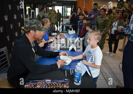 20171205-N-ZO368-030 CORONADO, Calif. (Dec. 5, 2017) WWE superstars and Divas conduct a meet and great autograph session at the Navy Exchange onboard Naval Base Coronado during a Tribute to the Troops event. Tribute to the Troops is an annual event held by WWE and Armed Forces Entertainment in December during the holiday season since 2003, to honor and entertain United States Armed Forces members. U.S. Navy photo by Mass Communication Specialist 1st Class Travis Alston (Released) Stock Photo