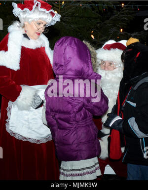 After Santa flipped the light switch at the Joint Multinational Readiness Center's Tree Lighting Ceremony, he and Mrs. Claus spent some time with the children of those assigned to the Hohenfels Training Area, Germany Dec. 8, 2017. (U.S. Army photo by Staff Sgt. David Overson) Stock Photo