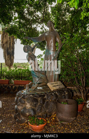 Bronze Sculpture of Jesus and Peter in the garden of Church of the Primacy of St. Peter on the coast of the sea of Galilea, Tabgha, Israel Stock Photo