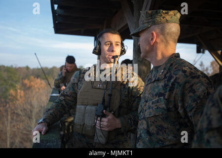 Maj. Gen. John Love speaks with Capt. Edward Fagan during his visit with Marines and sailors with 2nd Battalion, 8th Marine Regiment during the unit’s deployment for training exercise at Fort A.P. Hill, Va., Dec. 4, 2017. The visit allowed Love to observe the battalion’s readiness for an upcoming deployment to Japan. Love is the commanding general of 2nd Marine Division. (U.S. Marine Corps photo by Lance Cpl. Ashley McLaughlin) Stock Photo