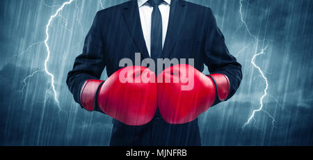 A dangerous sales person getting ready for a fight concept with red boxing  gloves and thunder lightning in background Stock Photo - Alamy