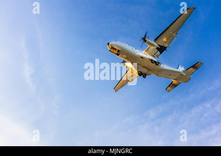 Turboprop air plane landing at Larnaca International Airport on a sunny afternoon Stock Photo