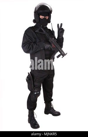 Riot police officer with weapon in black uniform isolated on white Stock Photo