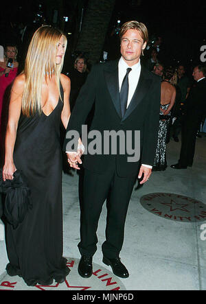 26 Mar 2000, Los Angeles, California, USA --- Jennifer Aniston Holding Hands with Brad Pitt --- ' Tsuni / Bourquard 'Jennifer Aniston  with Brad Pitt Jennifer Aniston  with Brad Pitt Jennifer Aniston  with Brad Pitt Event in Hollywood Life - California,  Red Carpet Event, Vertical, USA, Film Industry, Celebrities,  Photography, Bestof, Arts Culture and Entertainment, Topix  Celebrities fashion /  from the Red Carpet-1994-2000, one person, Vertical, Best of, Hollywood Life, Event in Hollywood Life - California,  Red Carpet and backstage, USA, Film Industry, Celebrities,  Photography, Bestof, Ar Stock Photo