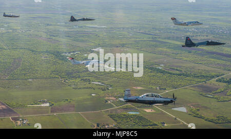 U.S. Air Force pilots assigned to the 560th Flying Training Squadron and the 99th Flying Training Squadron fly T-6 Texans, T-1 Jayhawks and T-38 Talons in a dissimilar formation in preparation for the 45th Annual Freedom Flyer Reunion over Joint Base San Antonio-Randolph, Texas, March 20, 2018. The Freedom Flyer Reunion is an annual celebration recognizing the incredible service of Air Force Prisoners of War during the Vietnam War, their honorable return, and their connection with the 12th Flying Training Wing during Operation Homecoming. Armed Forces and civilians displaying courage bravery d Stock Photo