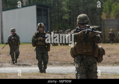 U.S. Marines from different units arm a breaching charge during an ...