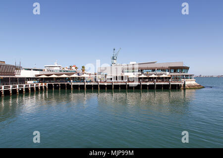 Melbourne, Australia: March 21, 2018: Waterfront Port in Beacon Cove. Restaurants and cafes along the Bay Trail on Port Melbourne Beach.