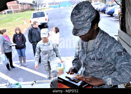 The North Whales Borough Parks and Recreation Military Living History Association, based in Hatboro, Pa., dropped off items donated at the collection campaign held during their historical tour event, A Soldier’s Christmas, to help the families of deployed service members Dec. 12, 2017, at Horsham Air Guard Station, Pa. The donation exhibits the continued support of State military members by local civilian organizations here despite the operational closure of Naval Air Station Joint Reserve Base Willow Grove Sept. 15, 2011. (U.S. Air National Guard photo by Tech. Sgt. Andria Allmond) Stock Photo